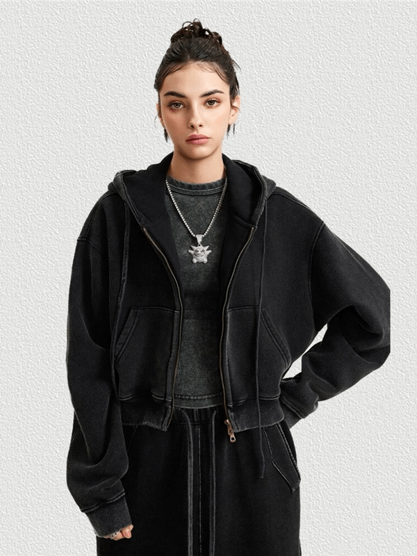Model wearing a fashionable fleece short women's hoodie with zipper, showcasing a stylish, distressed design for breezy evenings.